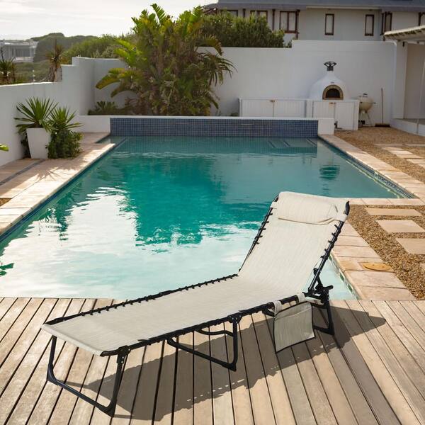 VEIKOUS Outdoor Folding Lounge Chair Fully Flat for Beach with Pillow and Side Pocket Beige
