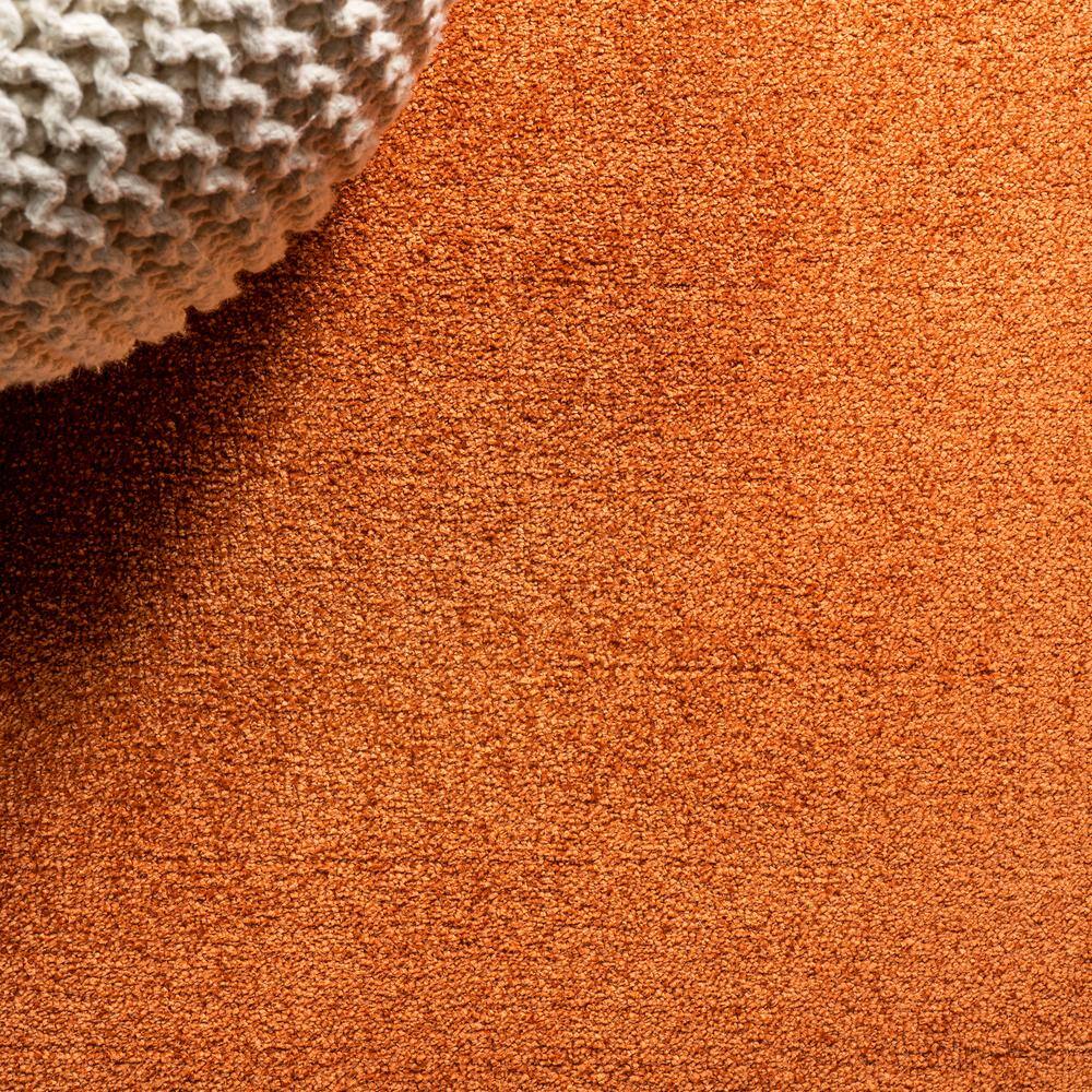 Haze Solid Orange 4' x 6' Oval Synthetic Area Rug