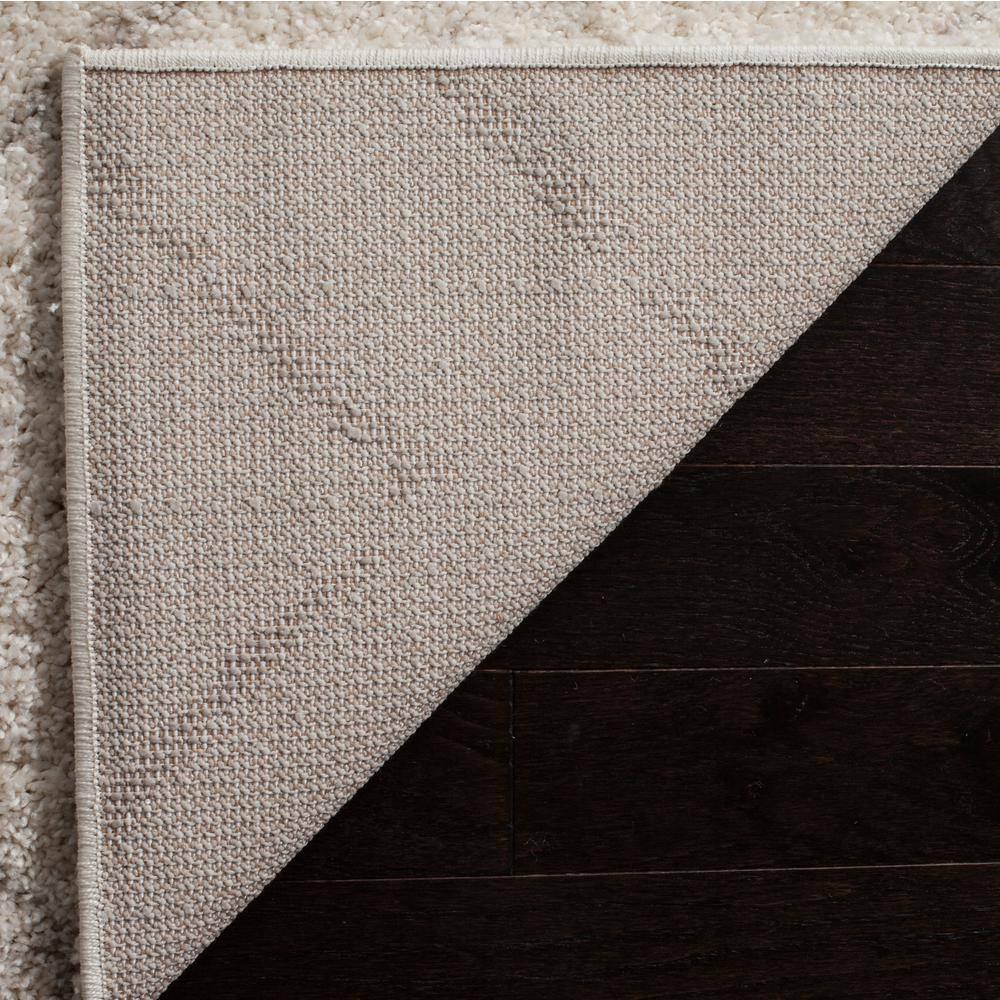 Ivory and Beige Geometric Shag 8' x 10' Area Rug