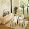 Dining set with white table and four beige upholstered chairs in a contemporary room.