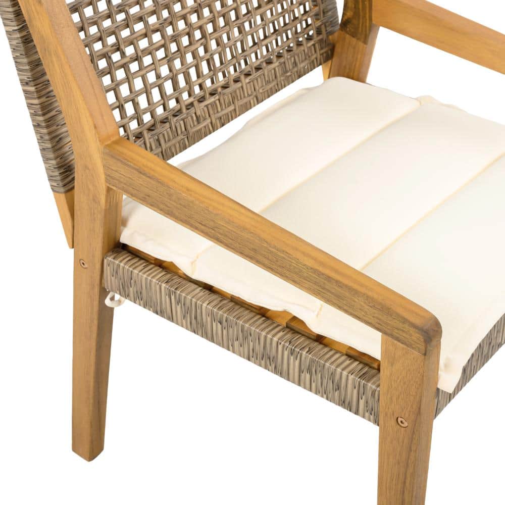 Close-up of the cream cushion and wooden armrest of a brown outdoor dining chair.