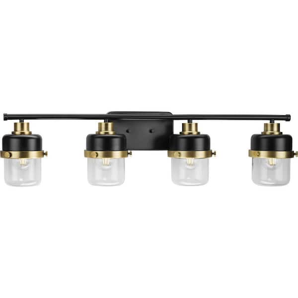 Beckner Collection 33.75 in. 4-Light Matte Black Clear Glass Urban Industrial Vanity Light with Vintage Brass Accents