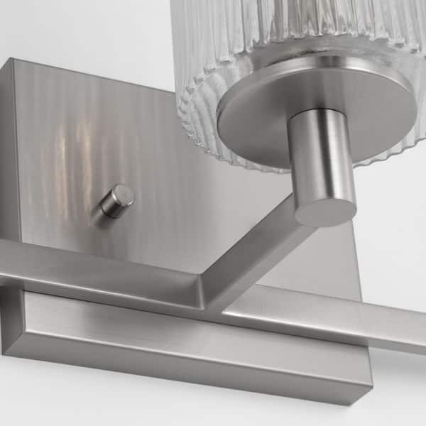 Generation Lighting - Lando 24.625 in. W 3-Light Brushed Steel Bathroom Vanity Light with Clear Fluted Glass Shades and LED Bulbs Included