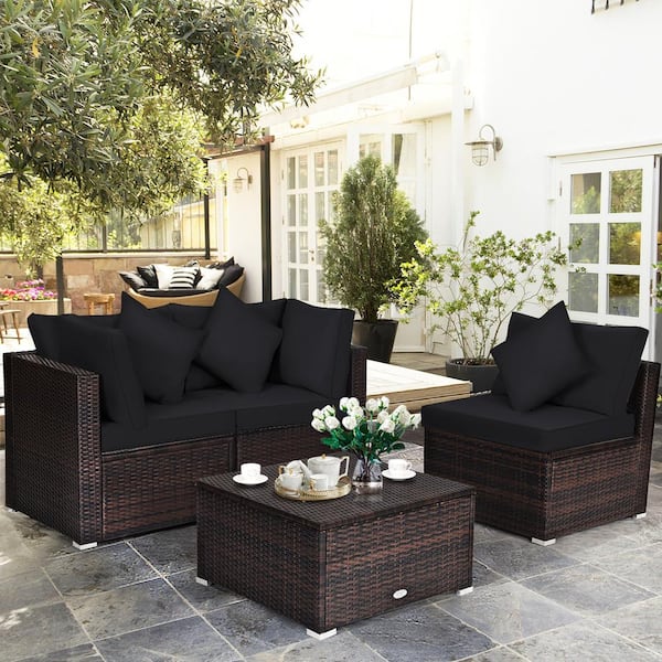 Liviza 4-Piece Outdoor Wicker Patio Conversation Set Brown Finish with Black Cushions and Pillows