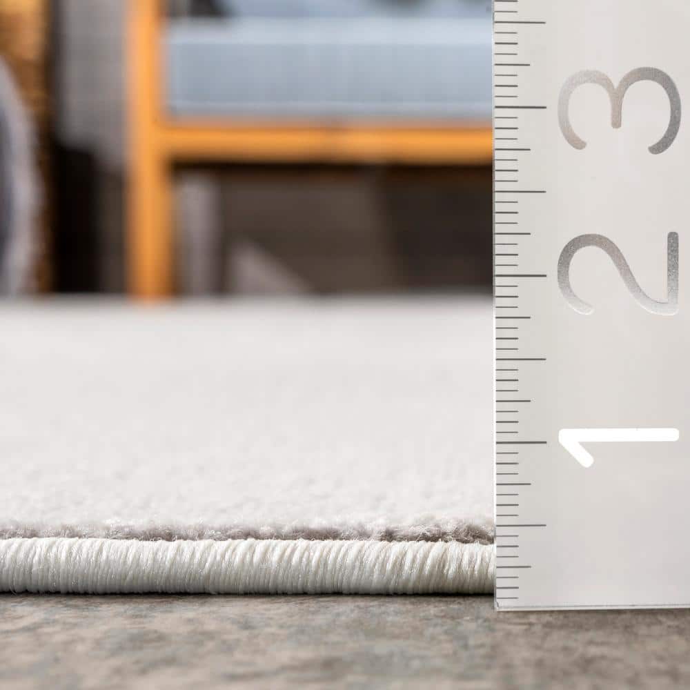 Beige Geometric Honeycomb 9' x 12' Synthetic Area Rug