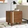 Nightstand next to a sofa with a modern desk lamp.