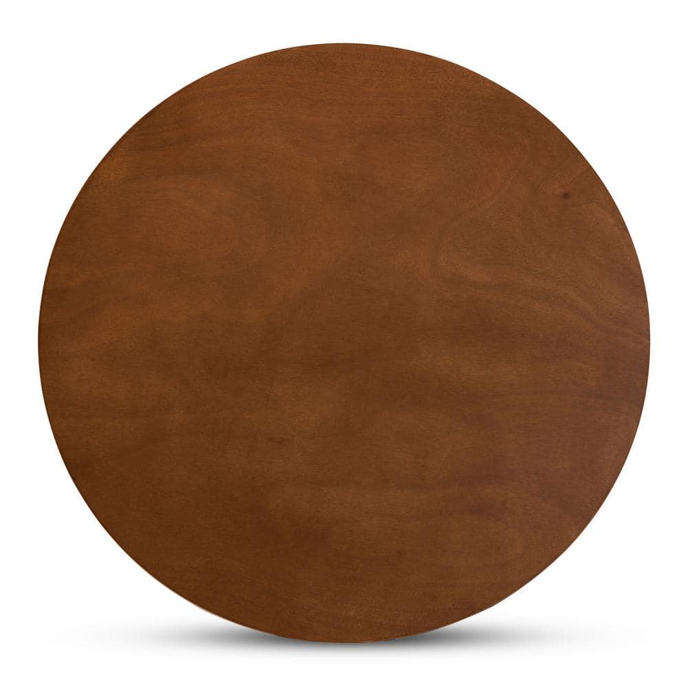 Top-down view of the round walnut brown dining table surface