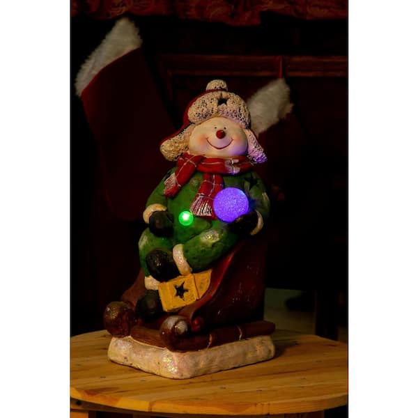 Alpine Corporation 19 in. Snowman on Sleigh with 3 Color Changing LED Lights
