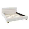 White upholstered bed frame with wooden slat base and round legs.