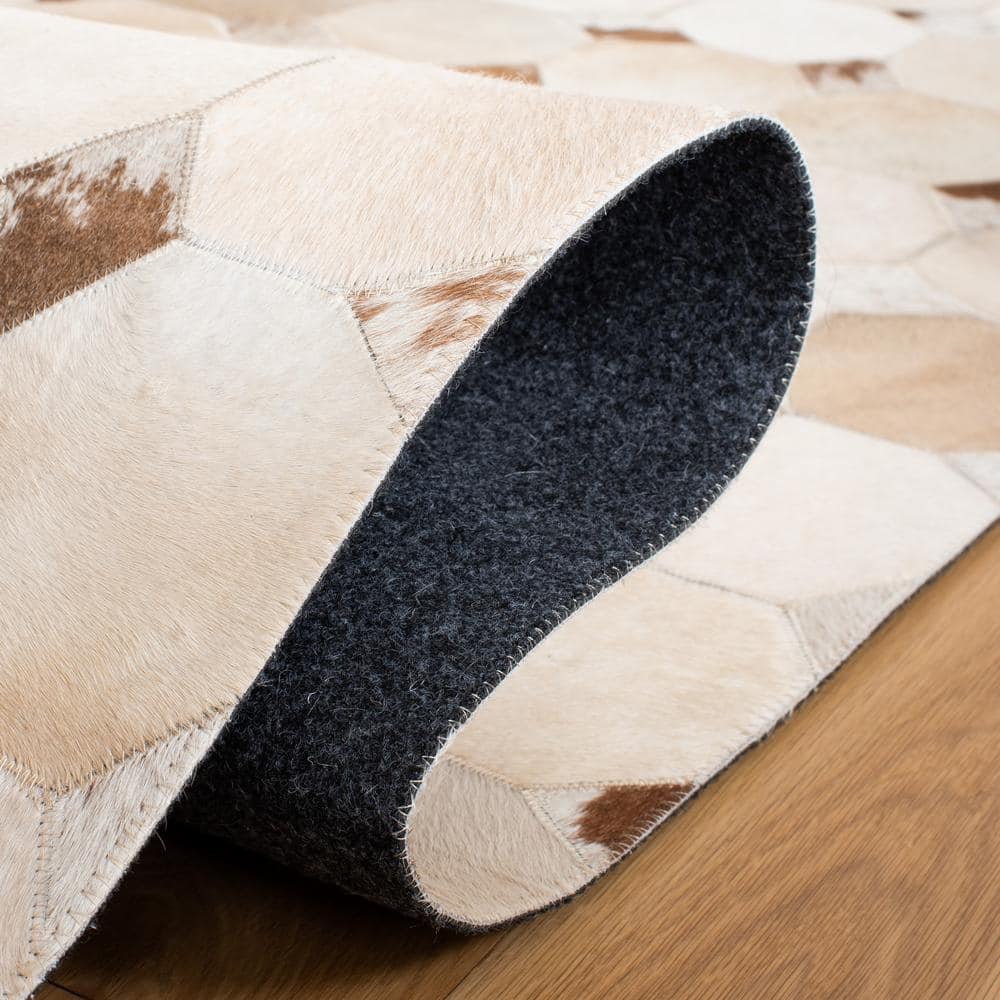 Hand-Stitched Ivory and Brown Geometric Cowhide Rug - 2'3" x 9'