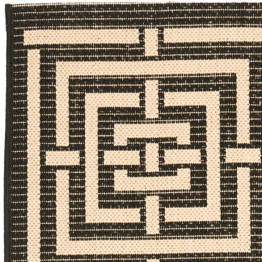Black and Bone Geometric Indoor/Outdoor Area Rug, 2'7" x 5'