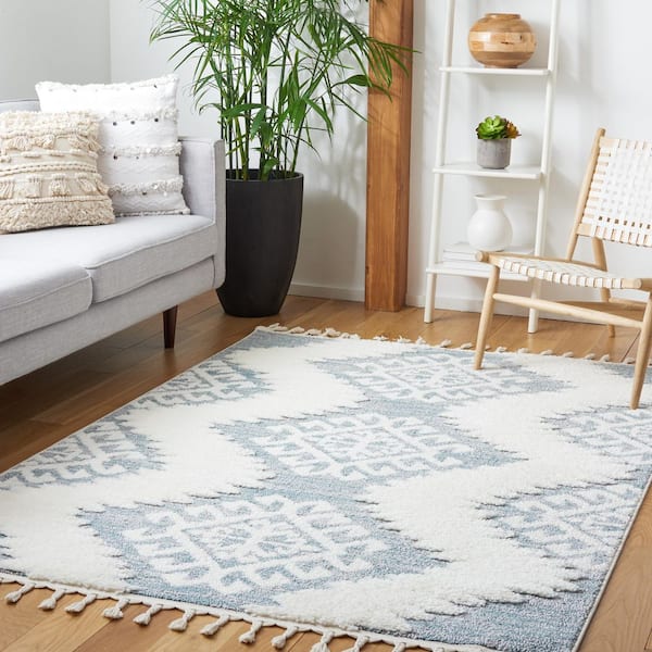 SAFAVIEH Moroccan Tassel Shag 4 ft. x 6 ft. Teal/Ivory Geometric