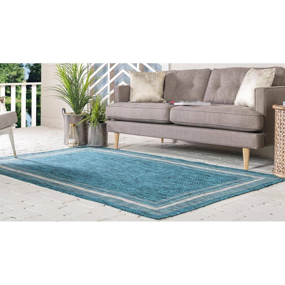 5' x 8' Teal Blue and Beige Flat Woven Outdoor Area Rug