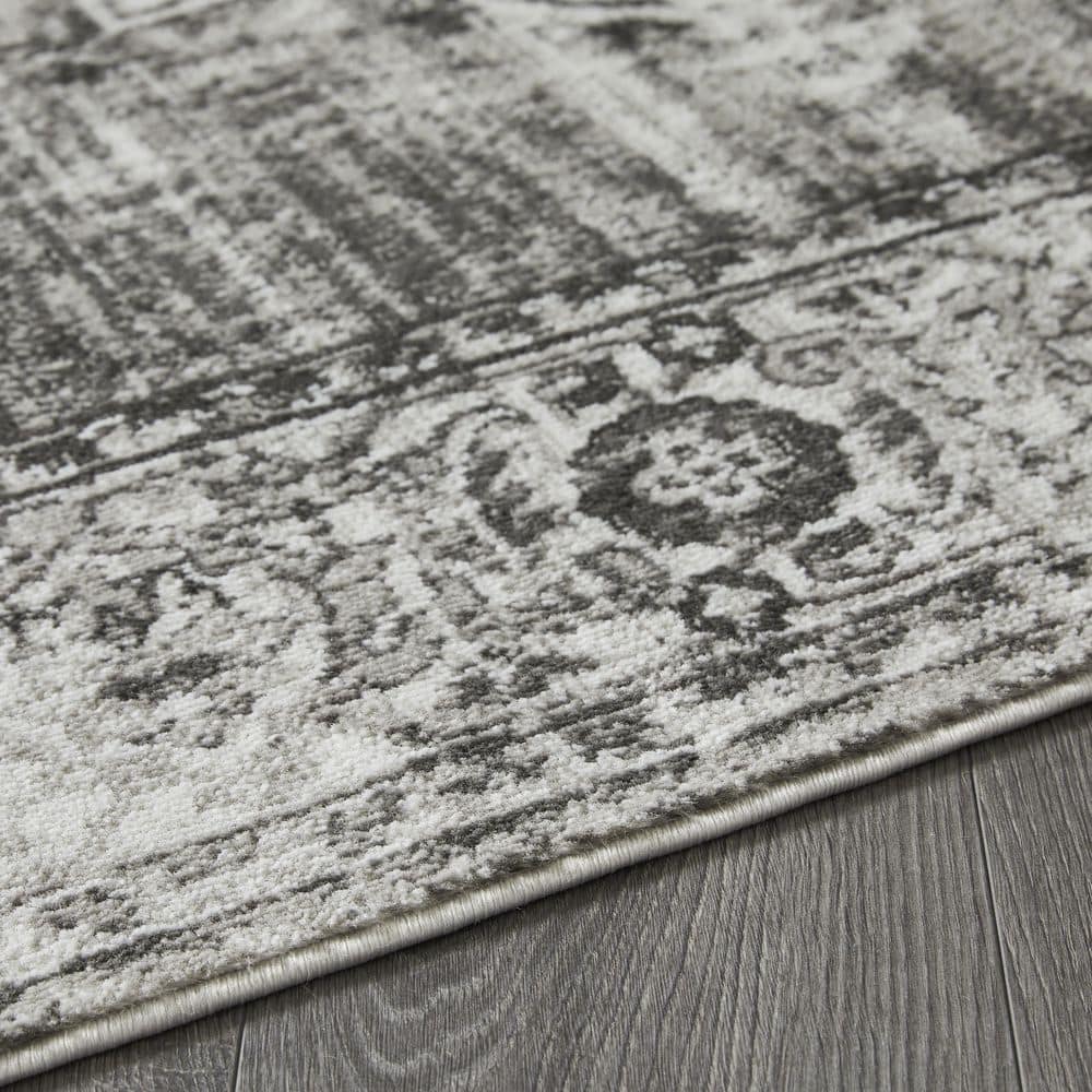 Ivory and Gray 9' x 12' Synthetic Oriental Rug