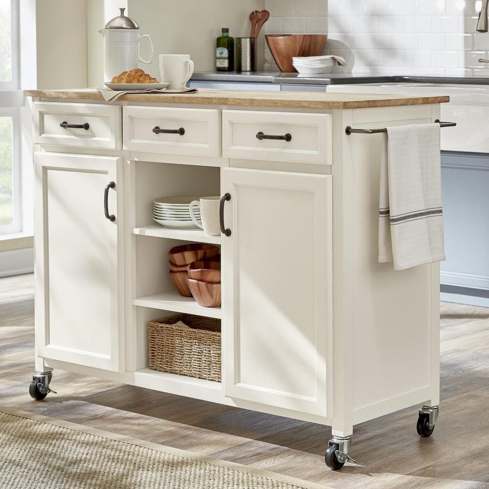 https://images.thdstatic.com/productImages/b1e77b13-37db-4933-ac7e-bf3f41aa590e/svn/ivory-with-butcher-block-top-home-decorators-collection-kitchen-carts-sk19304dr1-v-64_1000.jpg