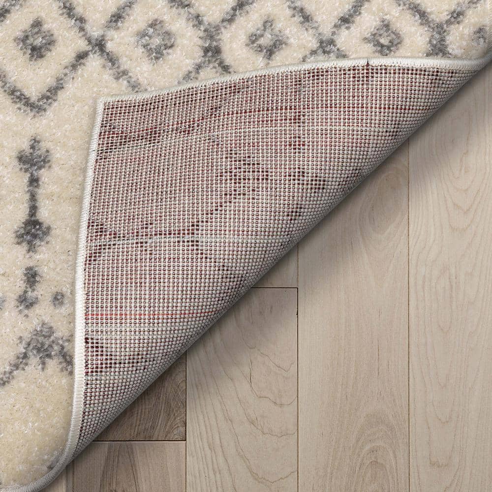 Ivory Grey Synthetic 5'3" x 7'3" Rectangular Easy-Care Area Rug