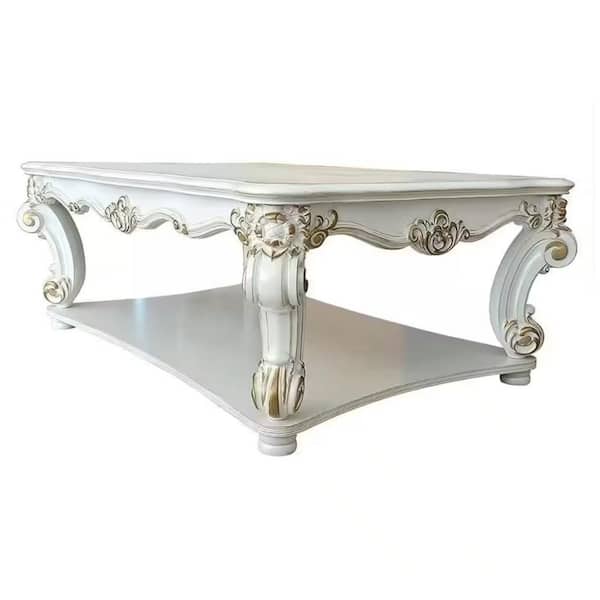 Jess 58 in. White and Gold Rectangle Wood Coffee Table with Brushed Gold Finish Accentuates The Stylish Carvings