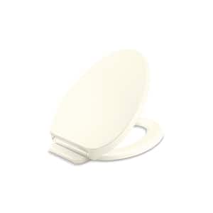 Drift ReadyLatch Elongated Quiet-Close Front Toilet Seat in Biscuit