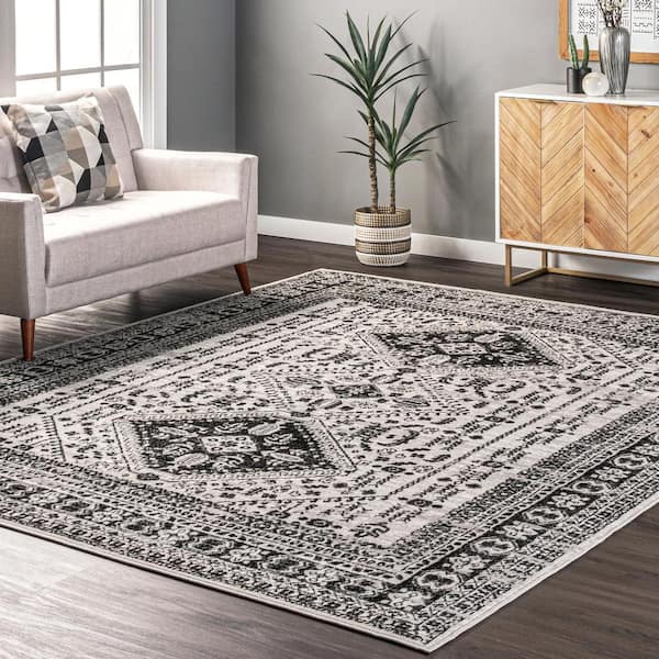 https://images.thdstatic.com/productImages/b2dcb27e-9565-4cc8-9192-87453bc0c6f6/svn/gray-nuloom-area-rugs-ecrk23a-2808-e1_600.jpg
