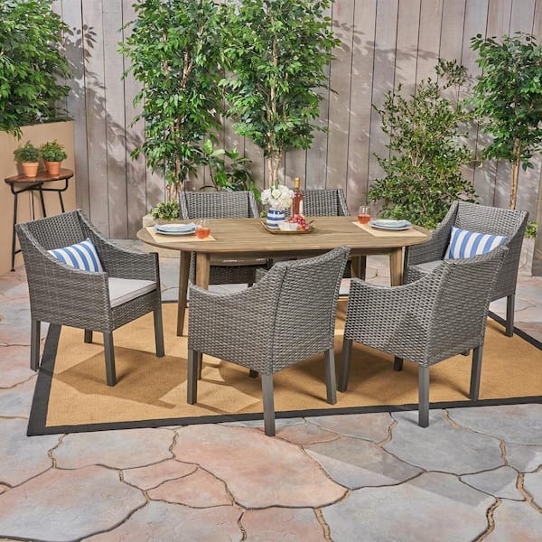 Noble House Stamford 7-Piece Wood and Faux Rattan Outdoor Dining Set with Silver Cushions