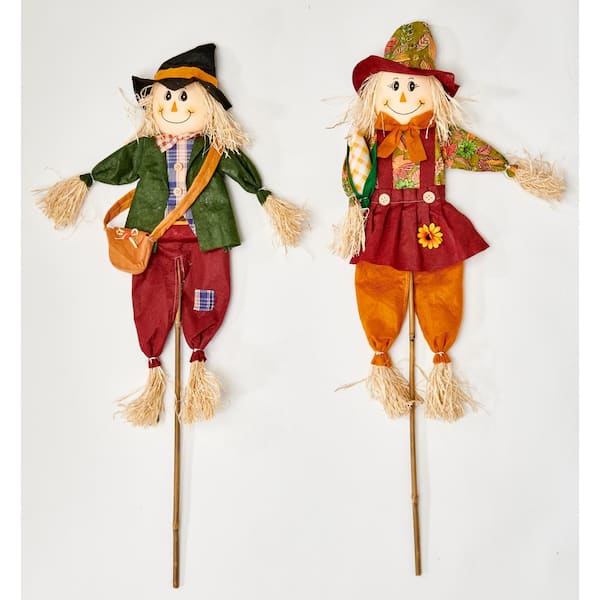 Unbranded 36 in. Boy and Girl Scarecrow on Stick with Sack or Corn (Set of 2)
