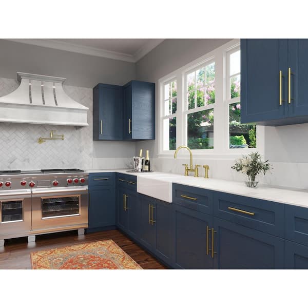 kitchen-remodel-navy-blue-gas-range-brushed-brass - HighCraft