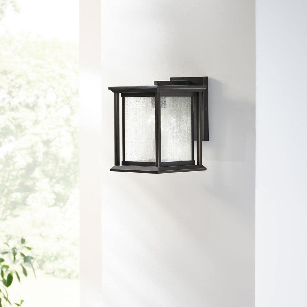 Audley 10 in. Antique Bronze with Distressed Seeded Glass Panels Outdoor Hardwired Lantern Sconce with No Bulbs Included price history on PriceWatchPro