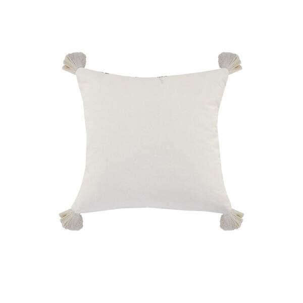 white tassel pillow
