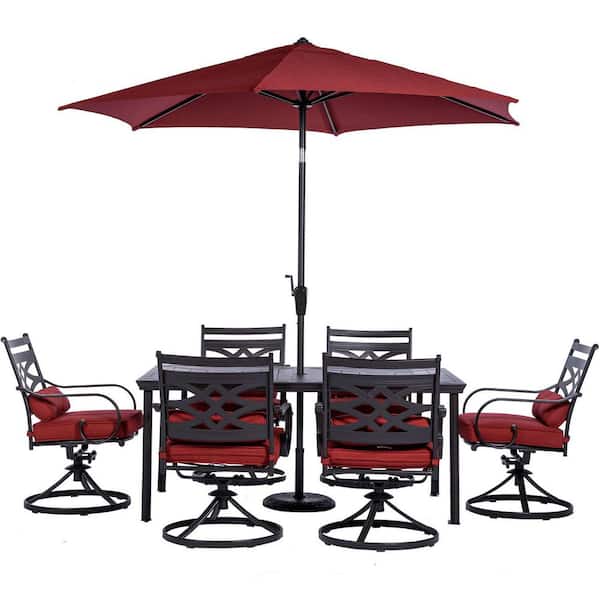 Hanover Montclair 7-Piece Steel Outdoor Dining Set with Chili Red Cushions, 6 Swivel Rockers, 40 in. x 66 in. Table and Umbrella