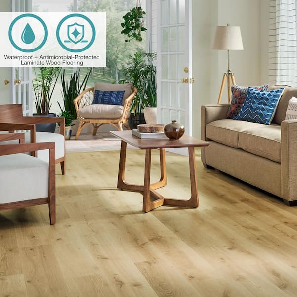 Pergo Defense+ 7.48 in. W Dayglow Golden Oak Waterproof Laminate Wood  Flooring (19.63 sq. ft./case) LF001065