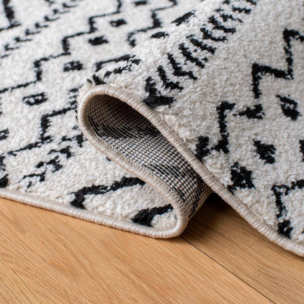8' x 10' Black and Ivory Geometric Synthetic Area Rug
