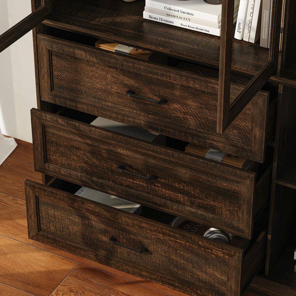 Close-up of the three open drawers of the walnut accent cabinet.