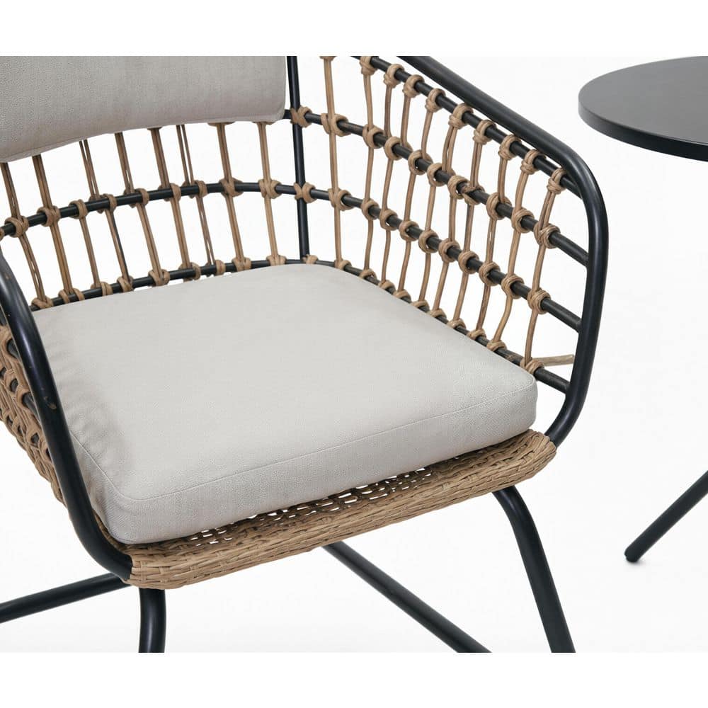 Close-up of the seat and weave of a wicker outdoor chair.