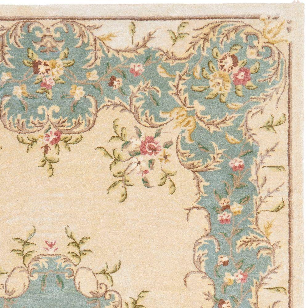 Ivory and Light Blue 6' x 9' Hand-Tufted Wool Area Rug