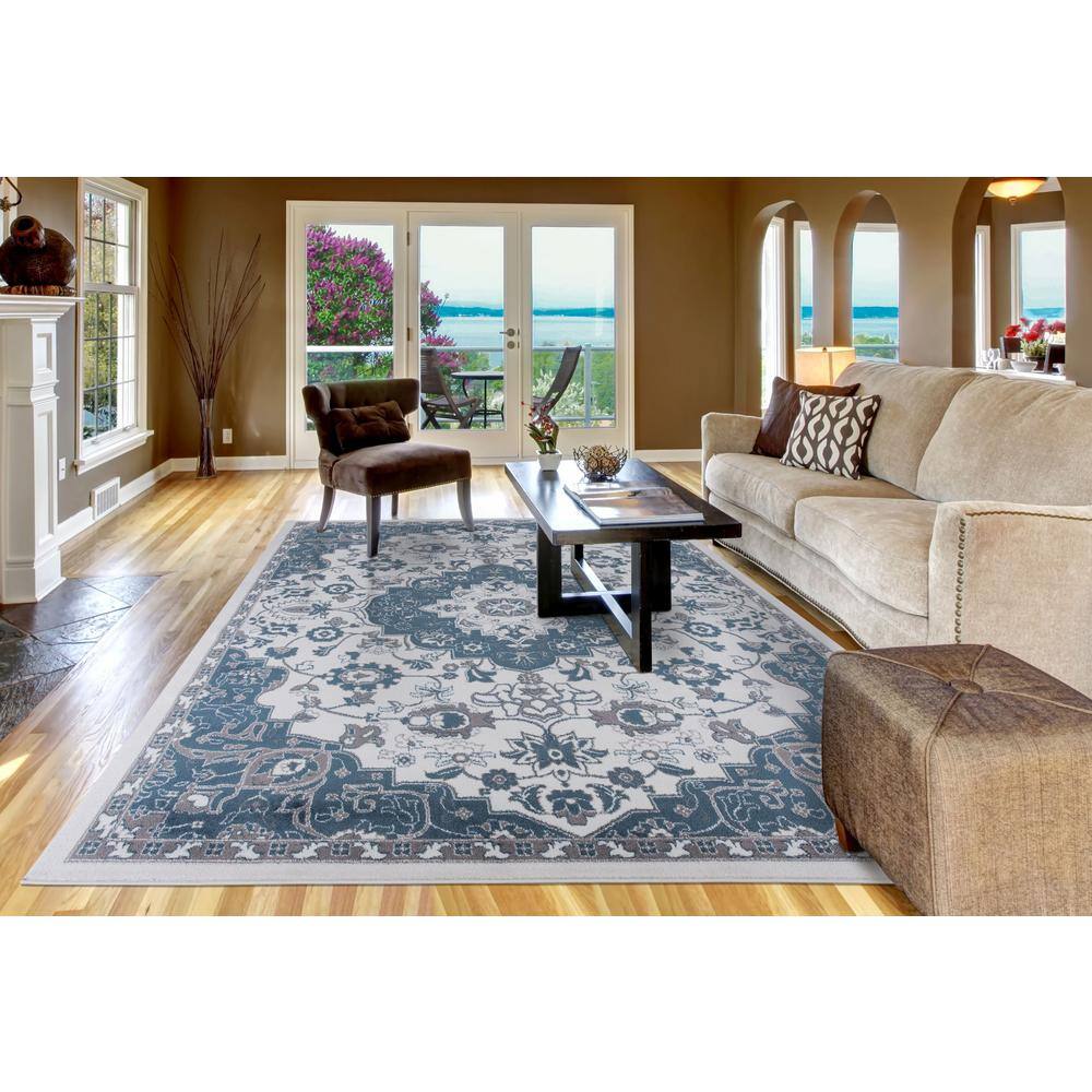 Ivory and Blue Synthetic Medium Pile 5' x 7' Area Rug