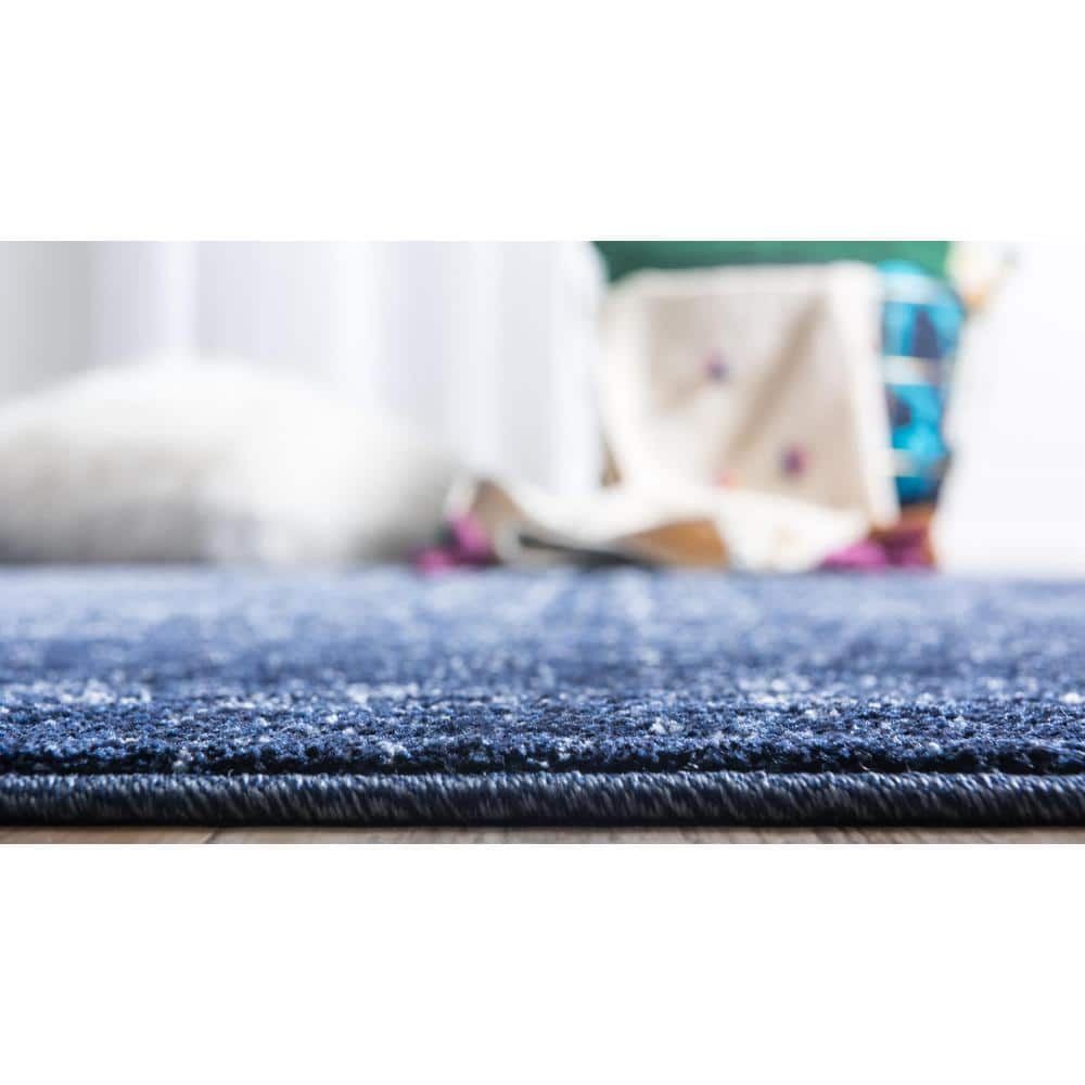Blue Tufted Washable Reversible 6' x 9' Synthetic Rug