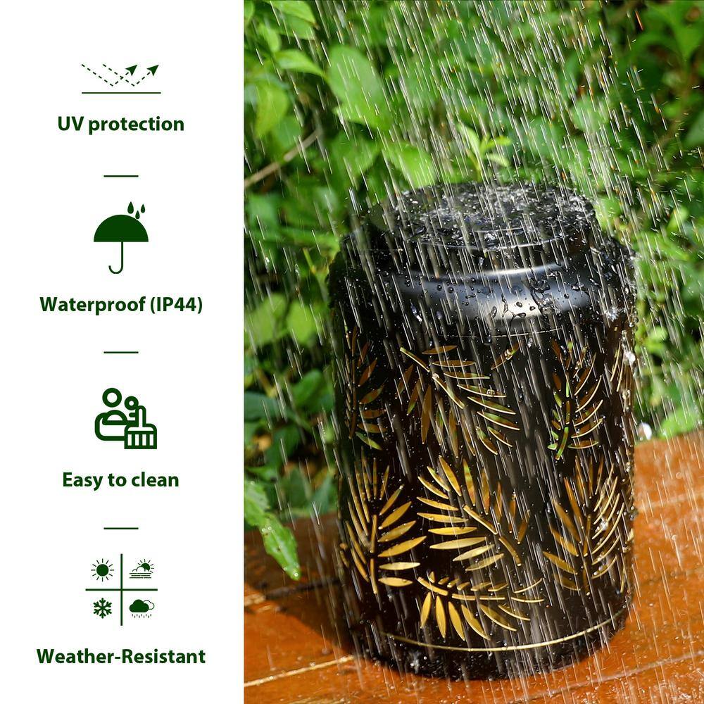 Black Metal Cylinder Solar Powered Outdoor Lantern with Leaf Cutouts