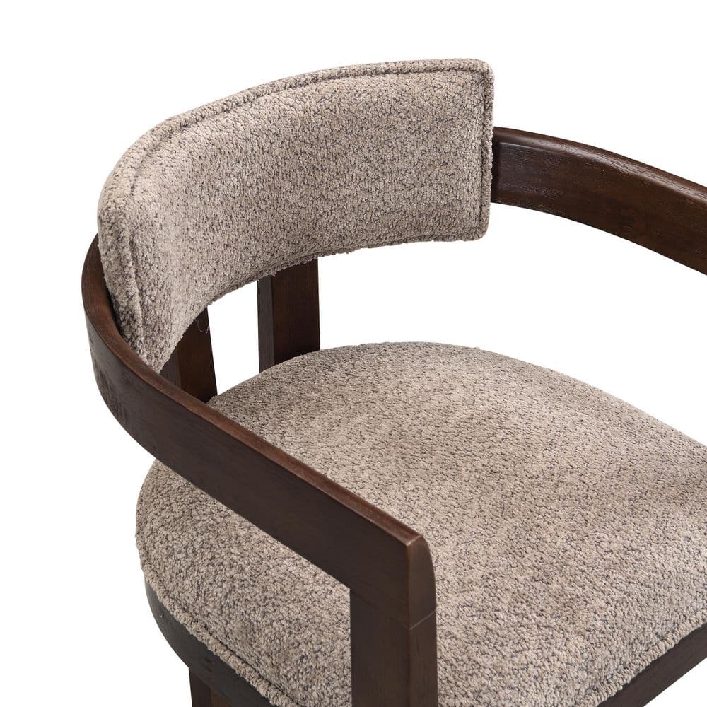 Close-up of the light brown textured fabric on an armchair.