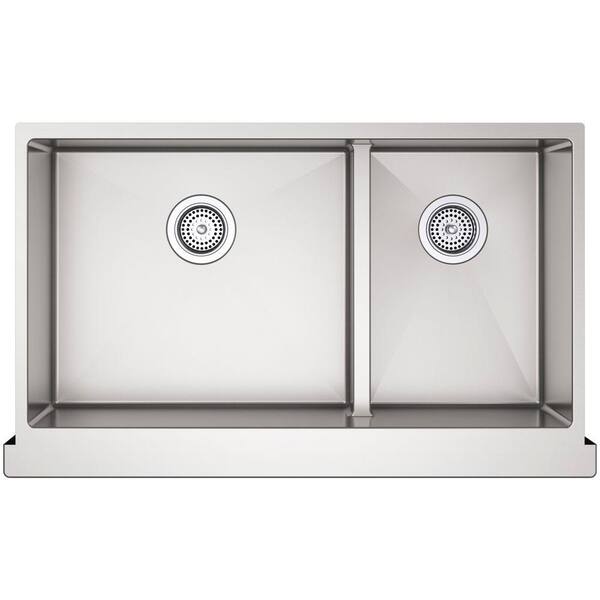 A window is located over a stainless steel apron sink paired with a deck  mount brass faucet and f…