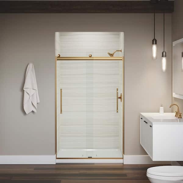 KOHLER Levity 44-48 in.W x 74 in. H Sliding Frameless Shower Door in Vibrant Brushed Moderne Brass with Clear Glass KOHLER Levity 44-48 in.W x 74 in. H Sliding Frameless Shower Door in Vibrant Brushed Moderne Brass with Clear Glass