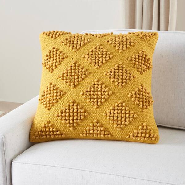 yellow textured throw pillow