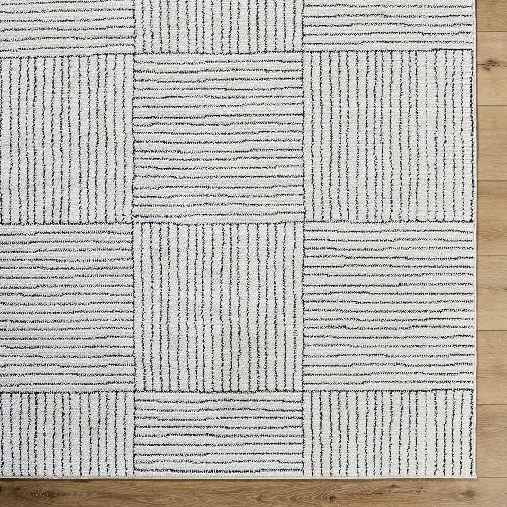Ivory and Black Geometric Patterned Synthetic Area Rug, 5' x 7'