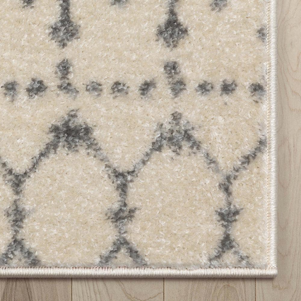 Ivory Grey Synthetic 5'3" x 7'3" Rectangular Easy-Care Area Rug