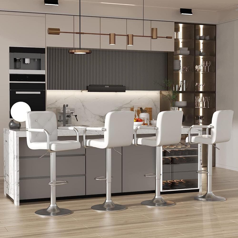 Four white bar stools lined up along a modern kitchen counter.