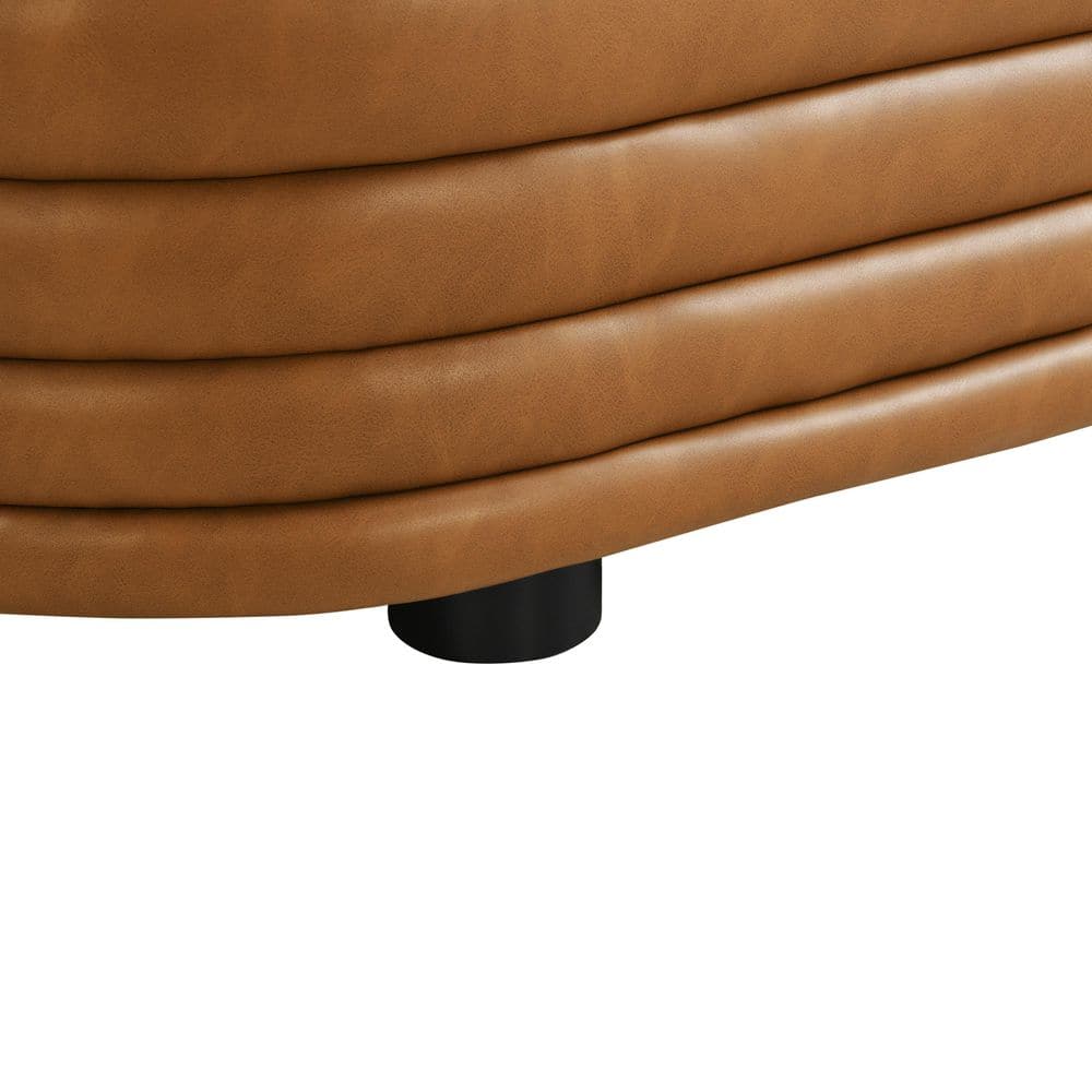 Detail view of the side profile of a tufted ottoman.