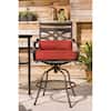 Lifestyle view of a Montclair swivel rocker chair with chili red cushions.