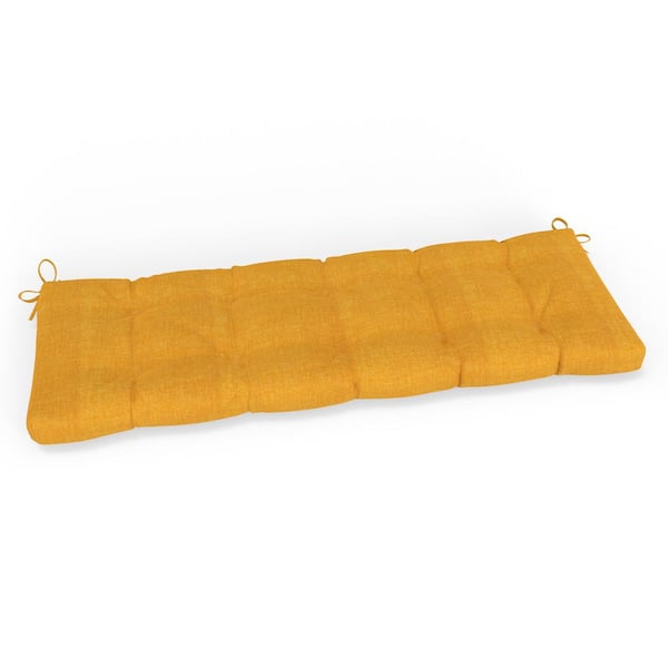 Pillow Perfect Solid Twill 56 in W x 5 in H Rectangular Outdoor Tufted Blown Bench Cushion w/ Ties 1-Count in Yellow Splash