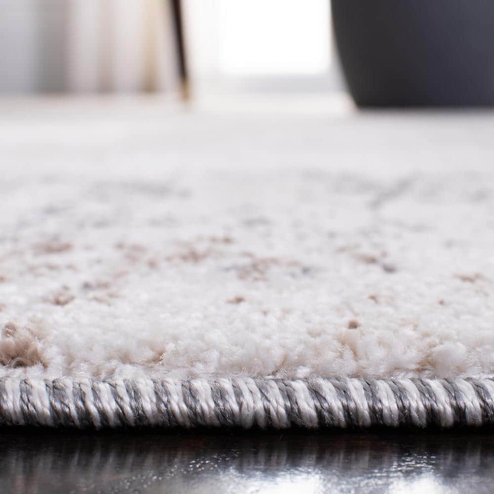 Ivory and Grey Abstract 8' x 10' Synthetic Area Rug