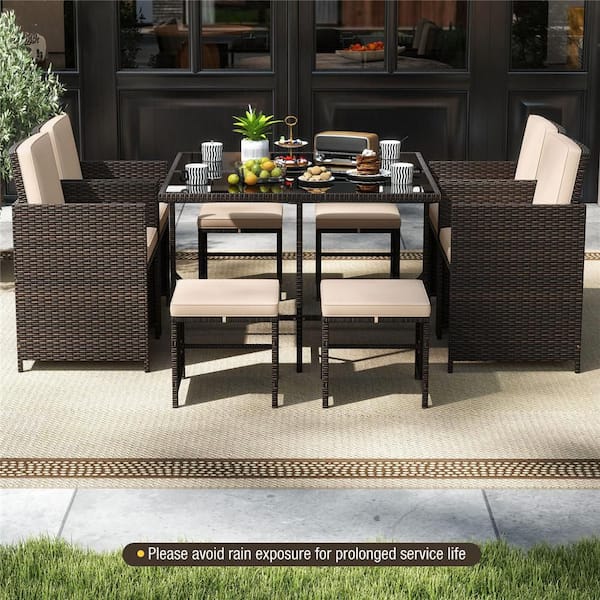 9-Piece Wicker Outdoor Dining Set with Tempered Glass Table and Ottoman Beige Removable Cushions