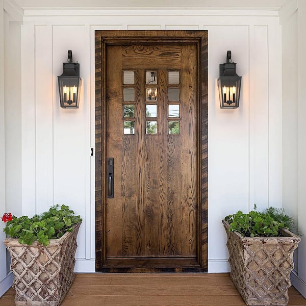 Hawaii 21 in. H Black Clear Glass Hardwired Dusk to Dawn Outdoor Wall Lantern Sconce